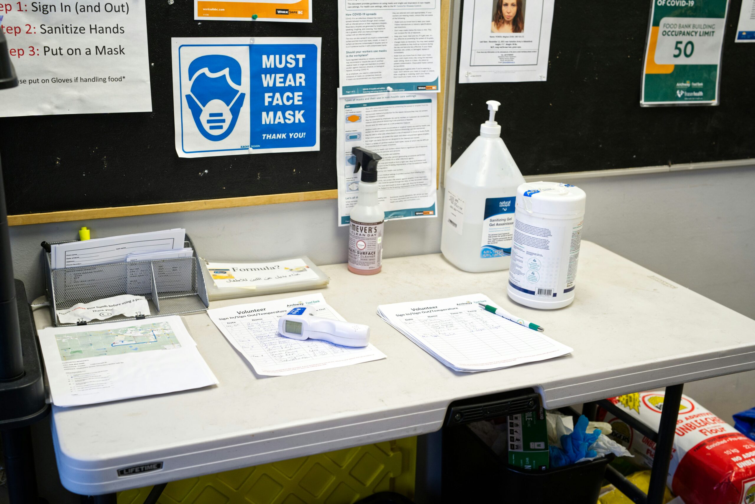 call centre cleaning: high-density workspace hygiene 13 Disinfecting a desk surface in an office