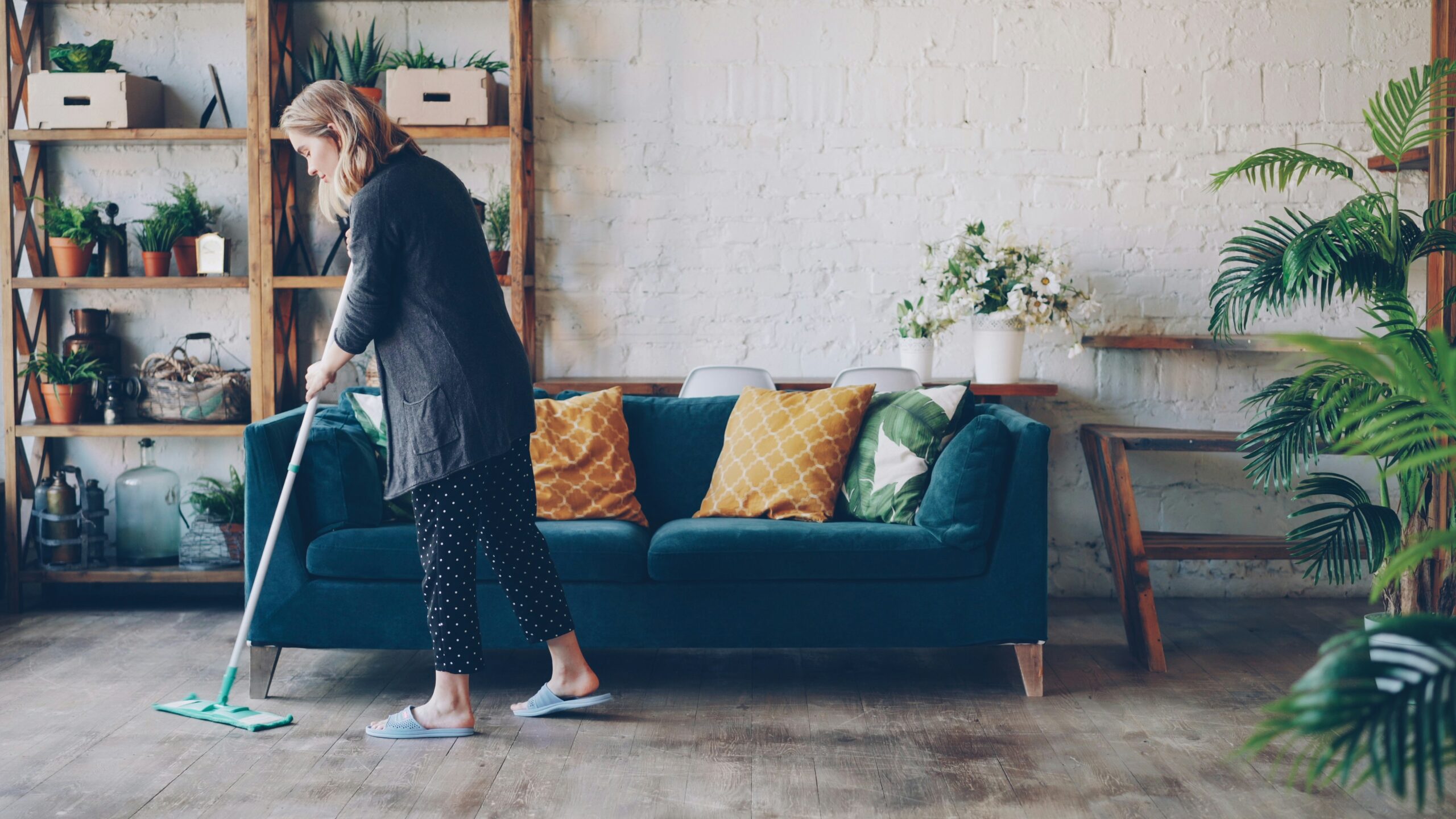 closing cleaning routine: 9 quick steps for any office 11 Cleaner mopping a floor as part of end-of-day cleaning