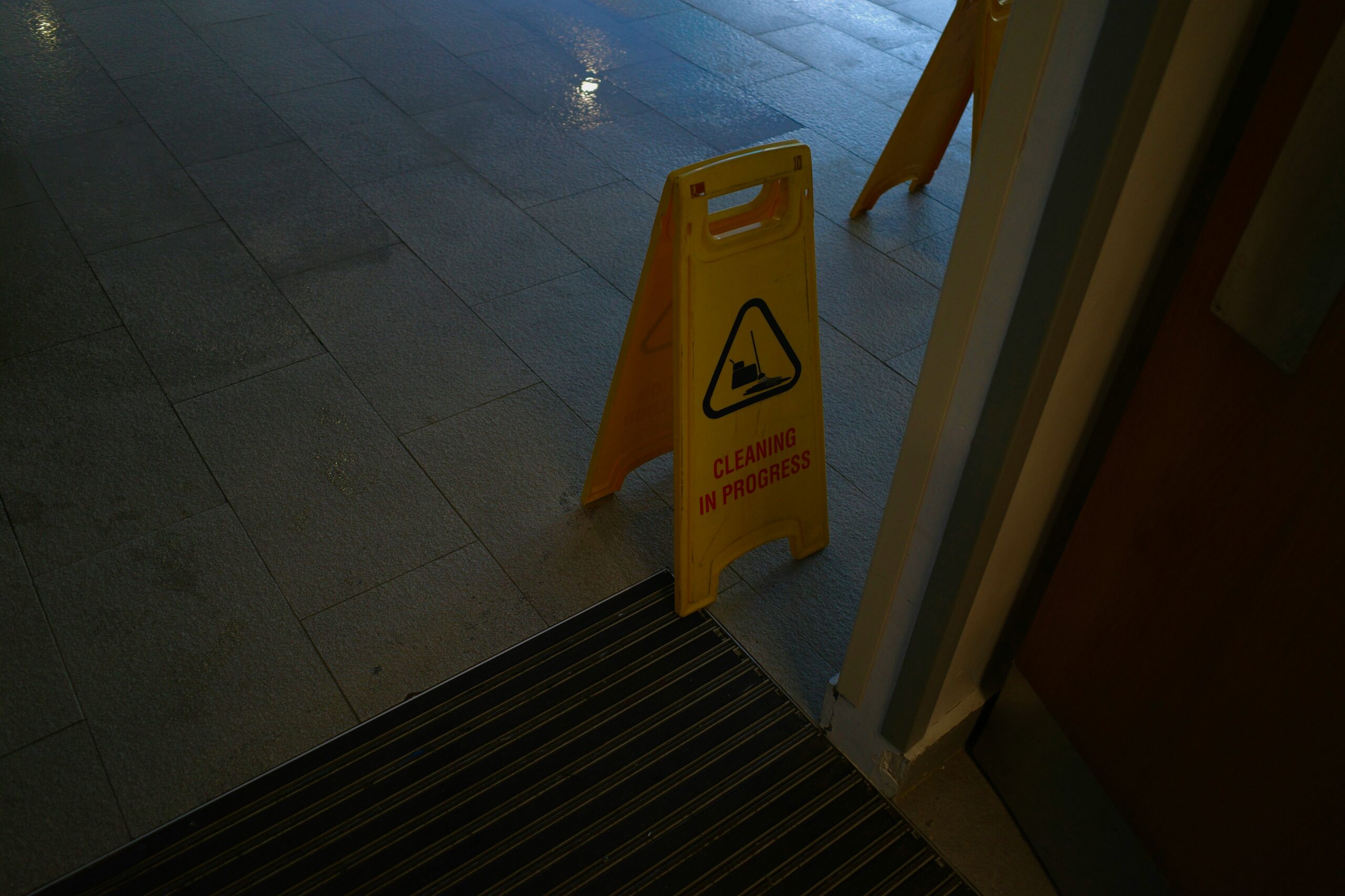 closing cleaning routine: 9 quick steps for any office 13 Wet floor sign used after quick mopping during closing