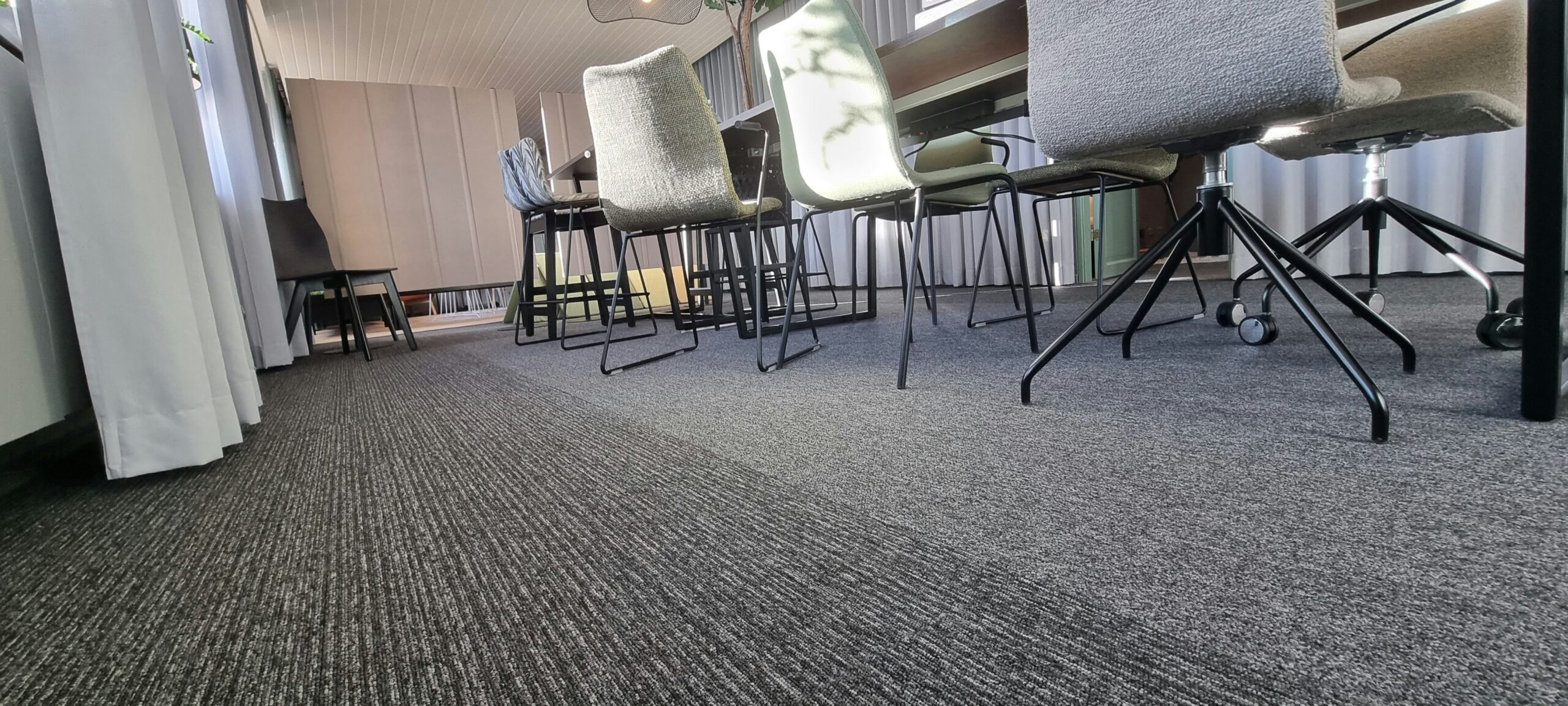 law office cleaning: maintaining professional environments 13 Vacuuming office carpet in a professional workspace