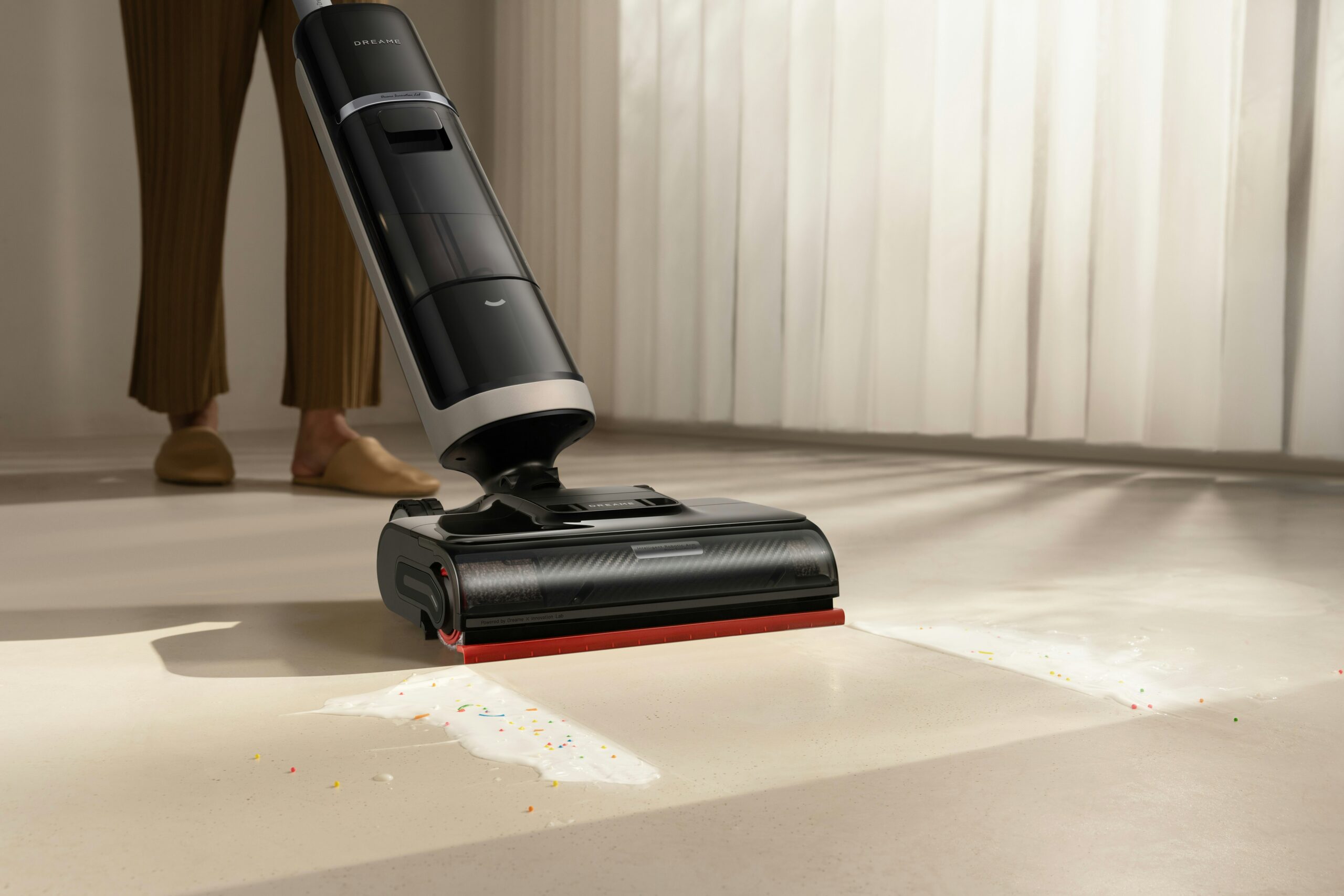 office dust comes back fast: 7 simple fixes that last 12 Person vacuuming a floor to capture dust in a workspace